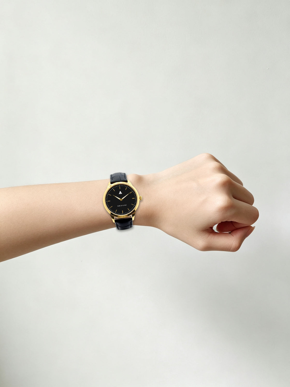 The Comeback Women’s Leather Watch — Gold / Black — on wrist