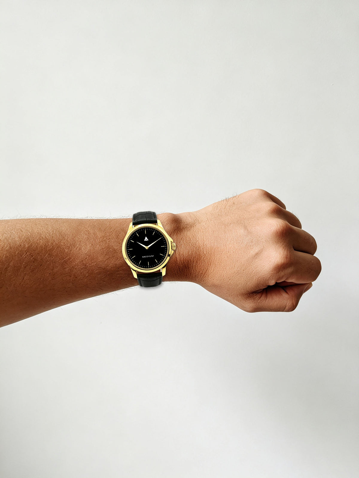 The Comeback Men’s Leather Watch — Gold / Black — on wrist